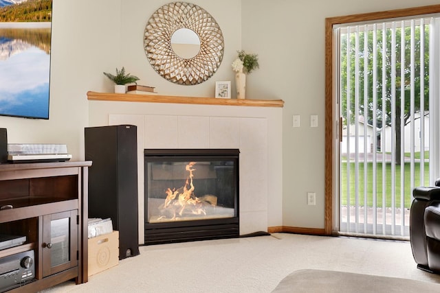 314 Archibald Ln, Dundas, MN 55019 - living area with a tiled fireplace, light colored carpet, and plenty of natural light