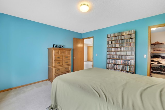 314 Archibald Ln, Dundas, MN 55019 - bedroom featuring carpet floors and a walk in closet