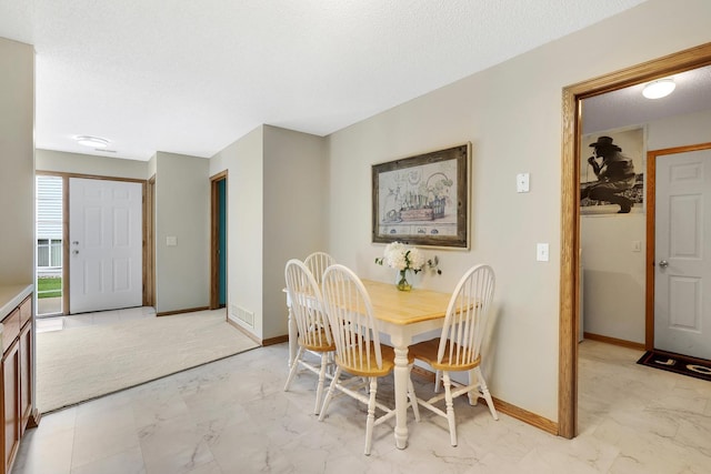 314 Archibald Ln, Dundas, MN 55019 - dining space featuring light marble finish floors and a textured ceiling