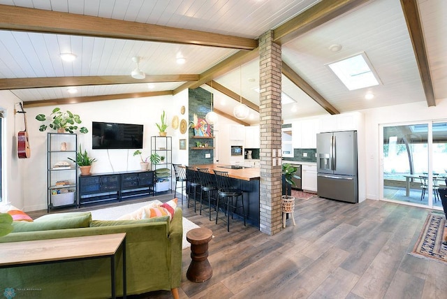 2833 1st St N, Fargo, ND 58102 - living area featuring dark wood-style floors, a skylight, wood ceiling, and recessed lighting