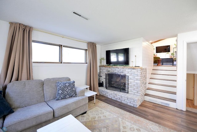 2833 1st St N, Fargo, ND 58102 - living room with wood finished floors, a fireplace, and stairs