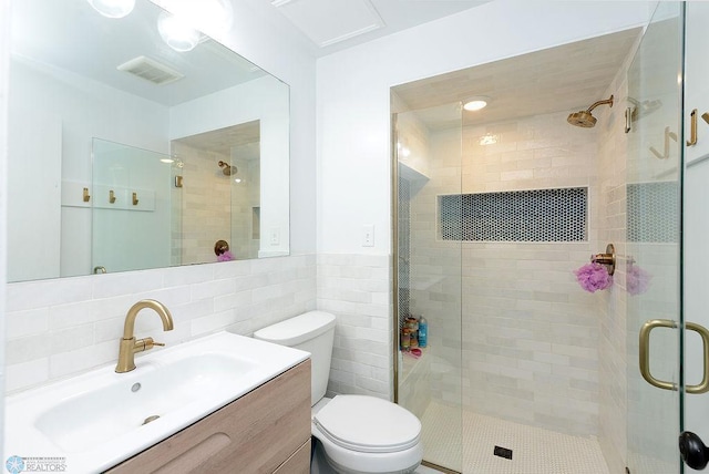 2833 1st St N, Fargo, ND 58102 - bathroom featuring tile walls, a shower stall, and vanity