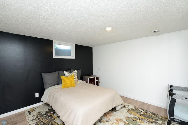 2833 1st St N, Fargo, ND 58102 - bedroom featuring a textured ceiling and light wood-type flooring