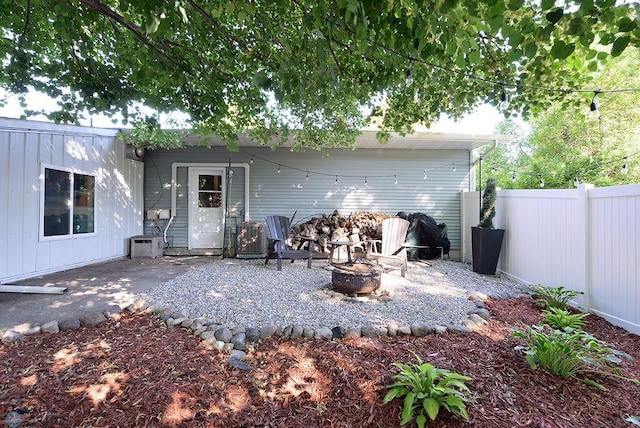 2833 1st St N, Fargo, ND 58102 - rear view of house featuring a fire pit and a patio