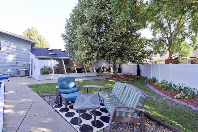 2833 1st St N, Fargo, ND 58102 - back of house with a sunroom, a patio, and roof with shingles