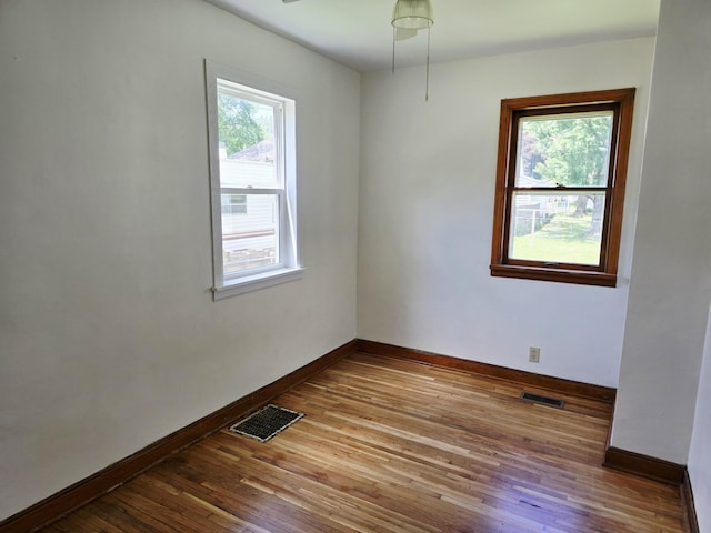 915 14th Ave SE, Austin, MN 55912 - spare room featuring hardwood / wood-style flooring