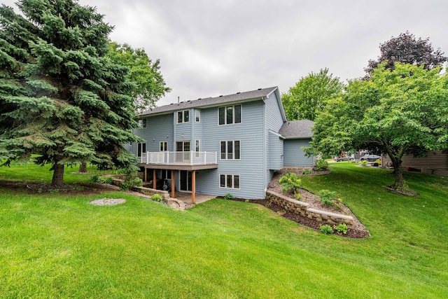 6262 Fernbrook Ln N, Maple Grove, MN 55311 - back of property with a yard, a deck, a patio, and roof with shingles