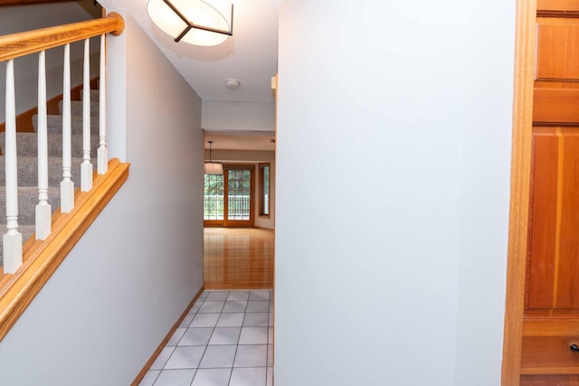 6262 Fernbrook Ln N, Maple Grove, MN 55311 - corridor with light tile patterned floors and stairs