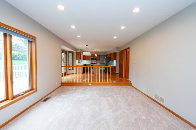 6262 Fernbrook Ln N, Maple Grove, MN 55311 - unfurnished living room with recessed lighting and light colored carpet