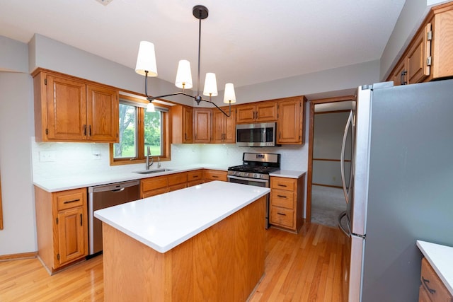 6262 Fernbrook Ln N, Maple Grove, MN 55311 - kitchen featuring stainless steel appliances, light wood-style floors, light countertops, backsplash, and a kitchen island
