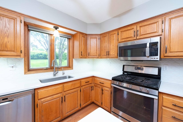 6262 Fernbrook Ln N, Maple Grove, MN 55311 - kitchen with stainless steel appliances, light countertops, and tasteful backsplash