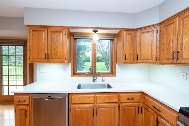 6262 Fernbrook Ln N, Maple Grove, MN 55311 - kitchen featuring dishwasher, light countertops, healthy amount of natural light, and backsplash