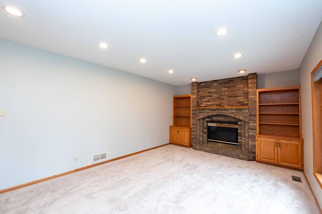 6262 Fernbrook Ln N, Maple Grove, MN 55311 - unfurnished living room with light carpet, recessed lighting, and a brick fireplace