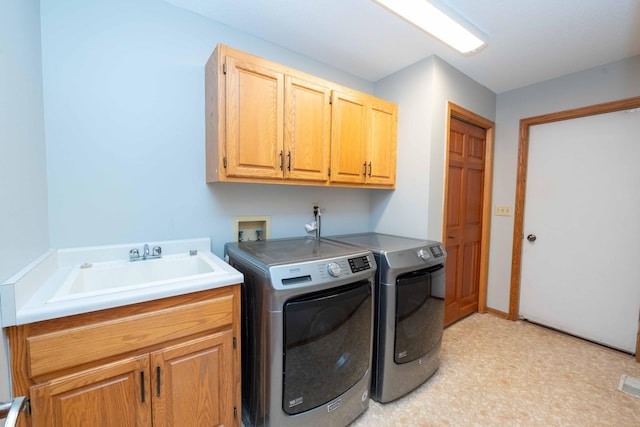 6262 Fernbrook Ln N, Maple Grove, MN 55311 - laundry room featuring washing machine and dryer, cabinet space, and light floors