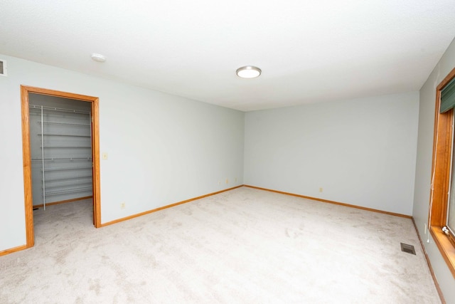 6262 Fernbrook Ln N, Maple Grove, MN 55311 - unfurnished bedroom featuring carpet flooring, a spacious closet, and a closet