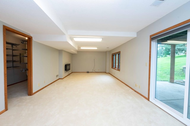 6262 Fernbrook Ln N, Maple Grove, MN 55311 - unfurnished room featuring heating unit, light carpet, and a glass covered fireplace