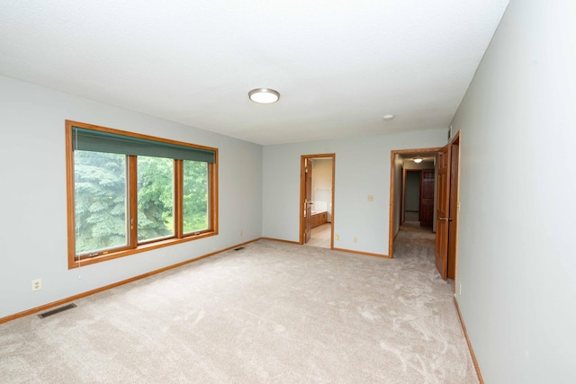 6262 Fernbrook Ln N, Maple Grove, MN 55311 - unfurnished bedroom featuring light colored carpet and connected bathroom