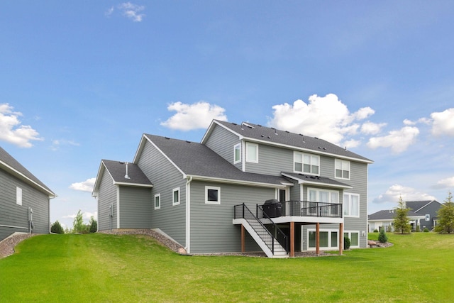 6333 Yuma Ln N, Maple Grove, MN 55311 - back of property with stairway, a wooden deck, a yard, and roof with shingles
