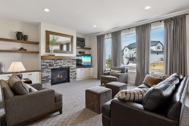 6333 Yuma Ln N, Maple Grove, MN 55311 - carpeted living room with a stone fireplace and recessed lighting