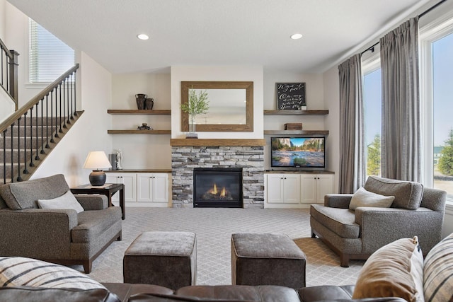 6333 Yuma Ln N, Maple Grove, MN 55311 - living room featuring light carpet, recessed lighting, a fireplace, and stairway