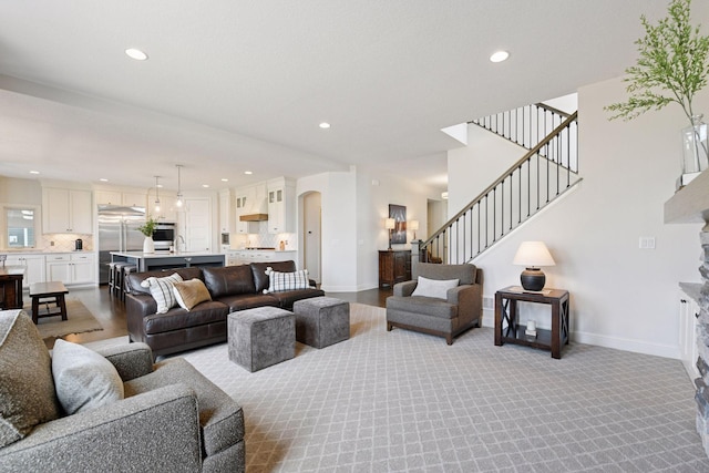 6333 Yuma Ln N, Maple Grove, MN 55311 - living room with recessed lighting, stairs, arched walkways, carpet floors, and a fireplace