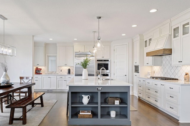 6333 Yuma Ln N, Maple Grove, MN 55311 - kitchen featuring open shelves, built in appliances, custom exhaust hood, white cabinets, and tasteful backsplash
