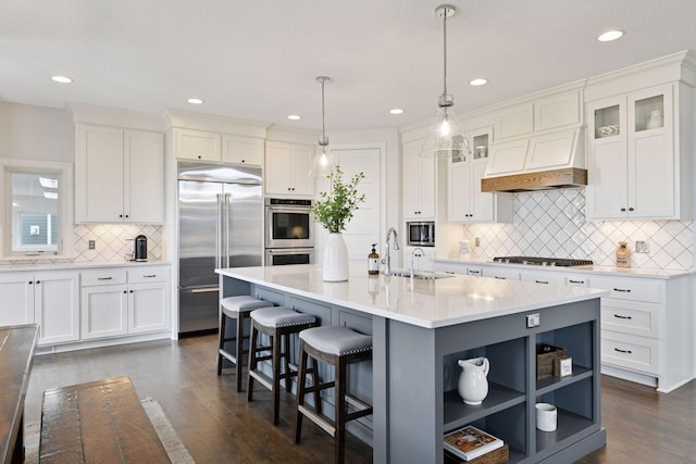 6333 Yuma Ln N, Maple Grove, MN 55311 - kitchen featuring built in appliances, custom exhaust hood, backsplash, white cabinetry, and recessed lighting
