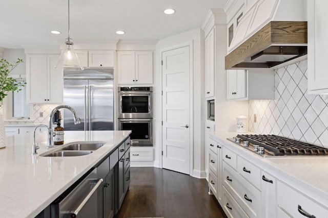 6333 Yuma Ln N, Maple Grove, MN 55311 - kitchen with appliances with stainless steel finishes, premium range hood, white cabinetry, tasteful backsplash, and recessed lighting