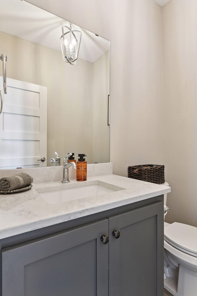6333 Yuma Ln N, Maple Grove, MN 55311 - half bathroom featuring vanity and toilet