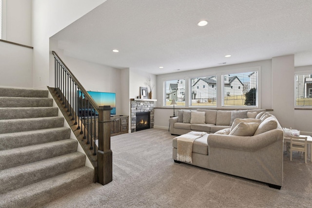 6333 Yuma Ln N, Maple Grove, MN 55311 - carpeted living area featuring healthy amount of natural light, recessed lighting, stairway, and a stone fireplace