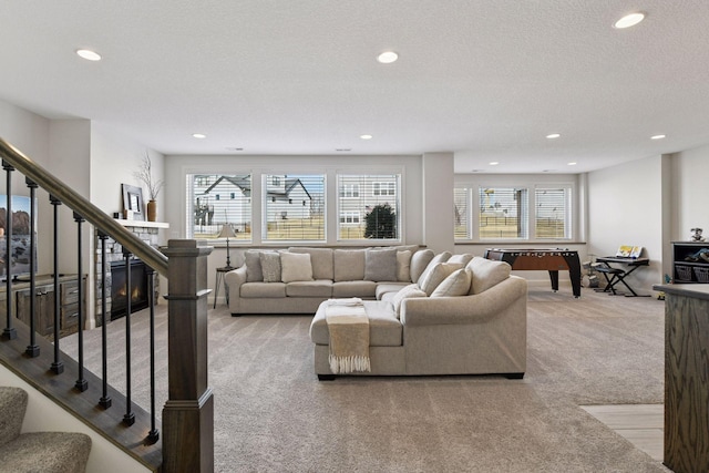 6333 Yuma Ln N, Maple Grove, MN 55311 - carpeted living room featuring recessed lighting, stairs, and a textured ceiling
