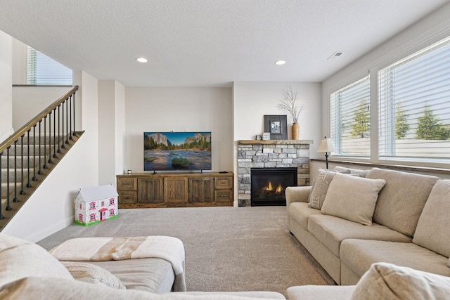 6333 Yuma Ln N, Maple Grove, MN 55311 - carpeted living room featuring recessed lighting, a fireplace, a textured ceiling, and stairs