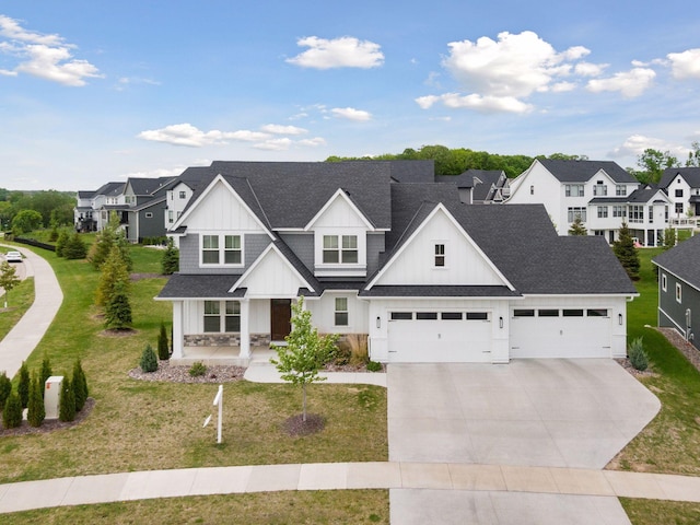 6333 Yuma Ln N, Maple Grove, MN 55311 - view of front of home with a residential view, concrete driveway, board and batten siding, and a shingled roof
