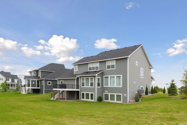 6333 Yuma Ln N, Maple Grove, MN 55311 - back of house featuring stairs, a deck, a lawn, and a residential view