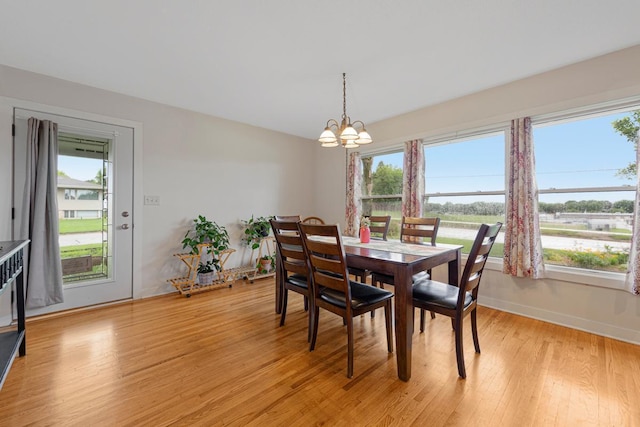 511 9th Ave SW, Faribault, MN 55021 - dining area with a chandelier, plenty of natural light, and light wood-style floors