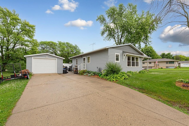 511 9th Ave SW, Faribault, MN 55021 - view of front of home with an outdoor structure, a detached garage, driveway, and a front lawn
