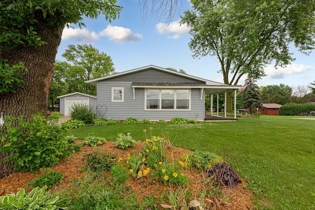 511 9th Ave SW, Faribault, MN 55021 - view of front of house with a front lawn, an outdoor structure, and a garage