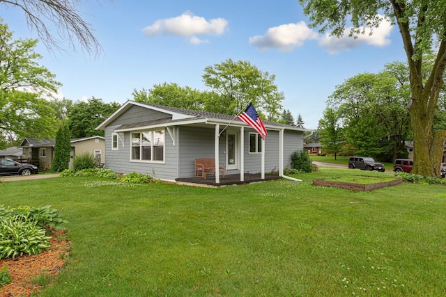 511 9th Ave SW, Faribault, MN 55021 - view of front of home featuring a front lawn and covered porch