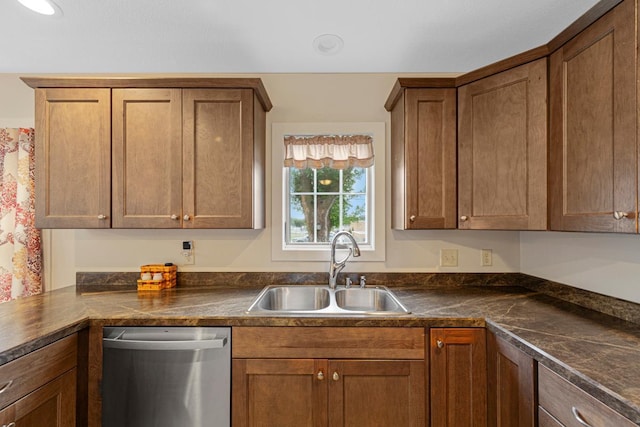 511 9th Ave SW, Faribault, MN 55021 - kitchen with stainless steel dishwasher, dark countertops, and brown cabinets