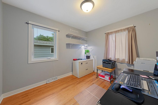 511 9th Ave SW, Faribault, MN 55021 - office area featuring light wood finished floors and baseboards