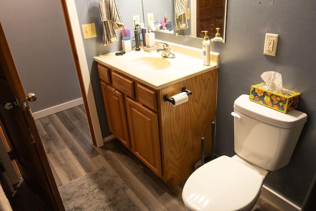 508 Jackson St SW, Hutchinson, MN 55350 - half bathroom with vanity and wood finished floors