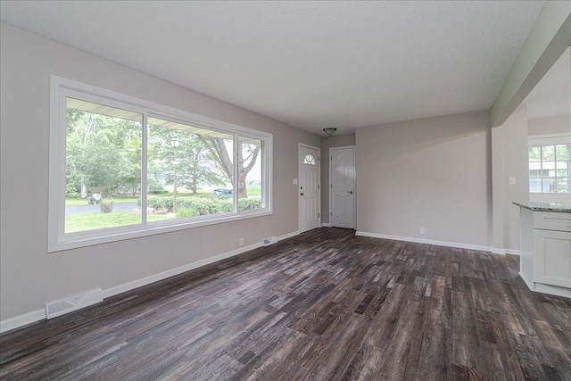 3667 205th St W, Farmington, MN 55024 - unfurnished living room featuring dark wood finished floors and baseboards