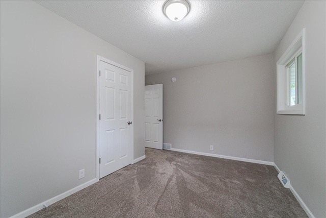 3667 205th St W, Farmington, MN 55024 - empty room featuring carpet floors and a textured ceiling
