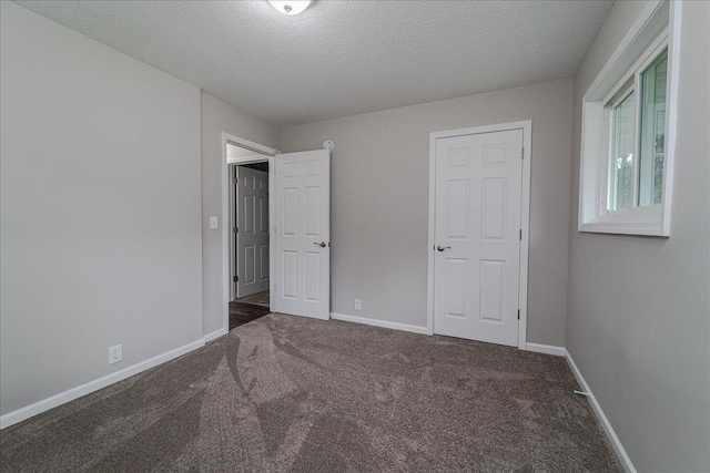 3667 205th St W, Farmington, MN 55024 - unfurnished bedroom with carpet floors and a textured ceiling