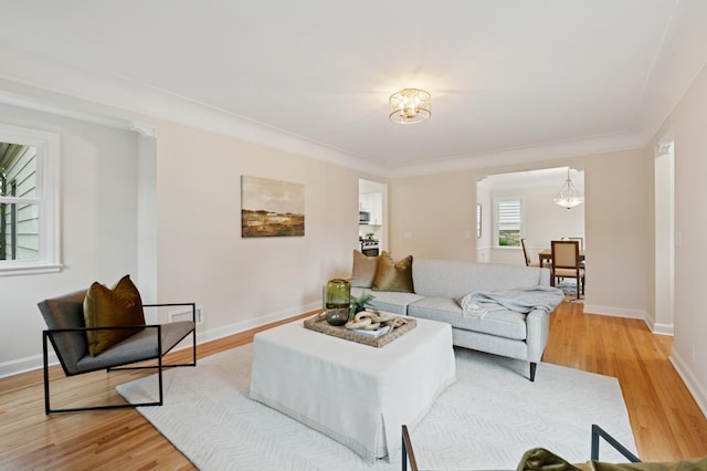 4236 22nd Ave S, Minneapolis, MN 55407 - living room featuring light wood-style flooring and a chandelier