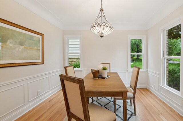 4236 22nd Ave S, Minneapolis, MN 55407 - dining area with light wood-style flooring, plenty of natural light, a decorative wall, and wainscoting