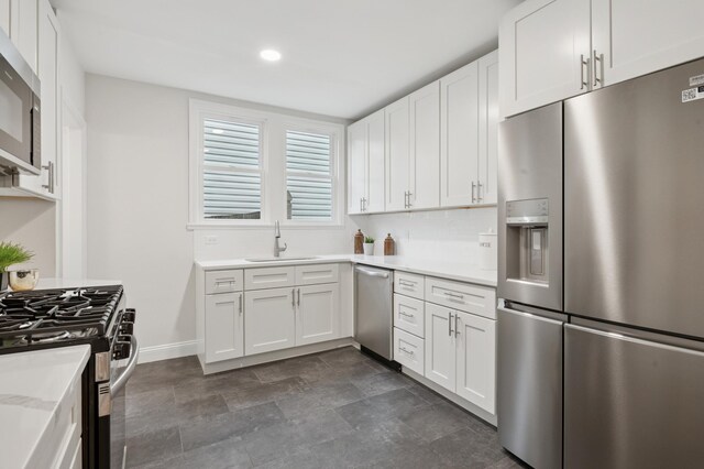4236 22nd Ave S, Minneapolis, MN 55407 - kitchen featuring appliances with stainless steel finishes, light countertops, white cabinets, recessed lighting, and tasteful backsplash
