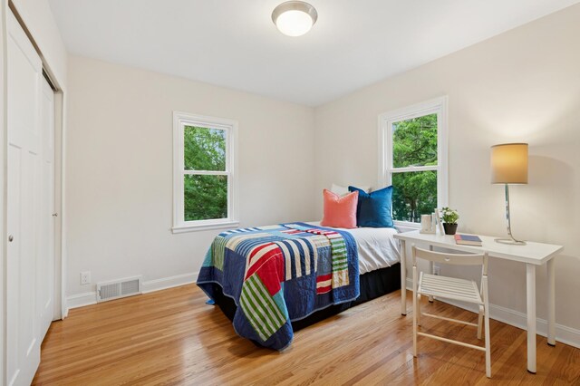 4236 22nd Ave S, Minneapolis, MN 55407 - bedroom featuring wood finished floors and a closet