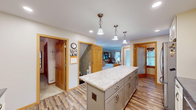216 1st St, Kiester, MN 56051 - kitchen featuring stainless steel appliances, light wood-type flooring, a center island, recessed lighting, and pendant lighting