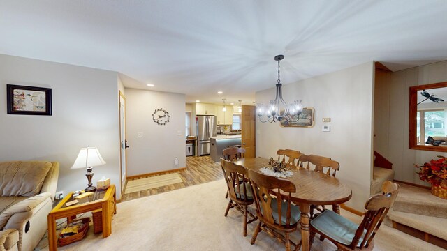 216 1st St, Kiester, MN 56051 - dining space featuring a chandelier, light carpet, and recessed lighting